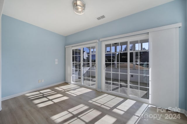 empty room featuring hardwood / wood-style flooring