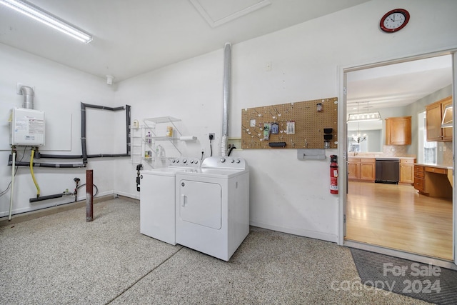 washroom featuring separate washer and dryer and water heater