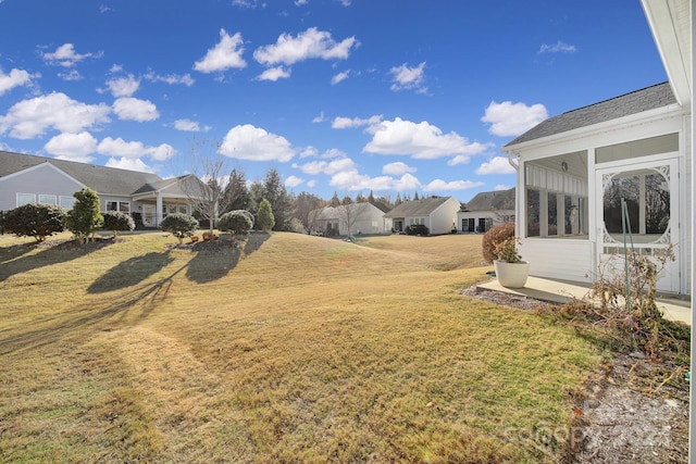 view of yard with a sunroom