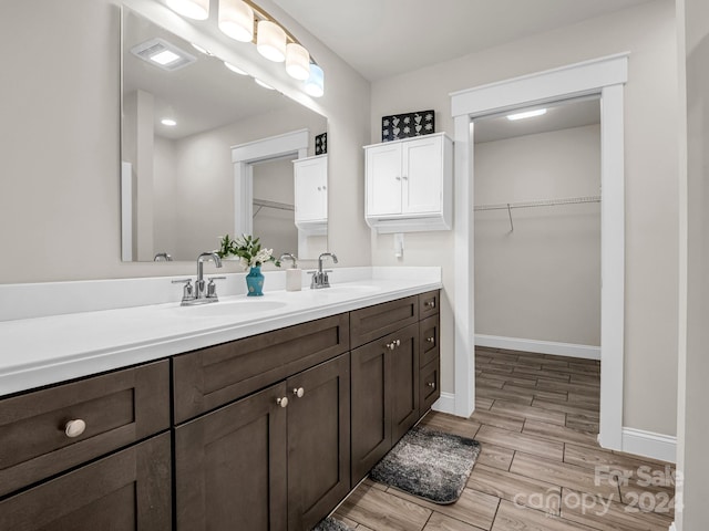 bathroom featuring vanity and hardwood / wood-style flooring