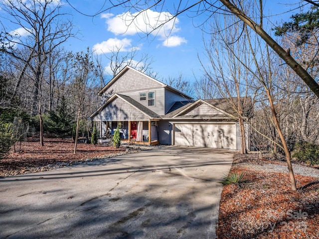 178 Flynn Ct, Lake Lure, NC 28746 - view of front of home with a porch, an attached garage, and concrete driveway