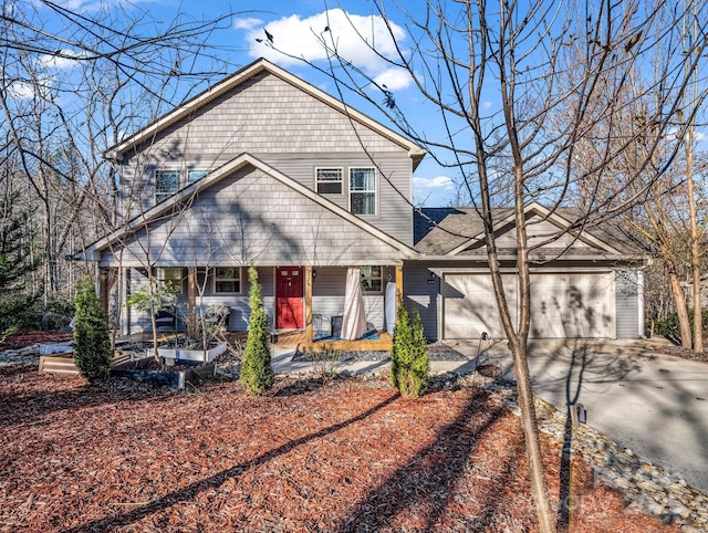 178 Flynn Ct, Lake Lure, NC 28746 - view of front of house featuring a porch, an attached garage, and driveway