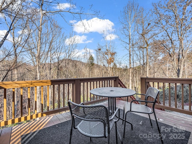178 Flynn Ct, Lake Lure, NC 28746 - wooden deck featuring a mountain view and outdoor dining area