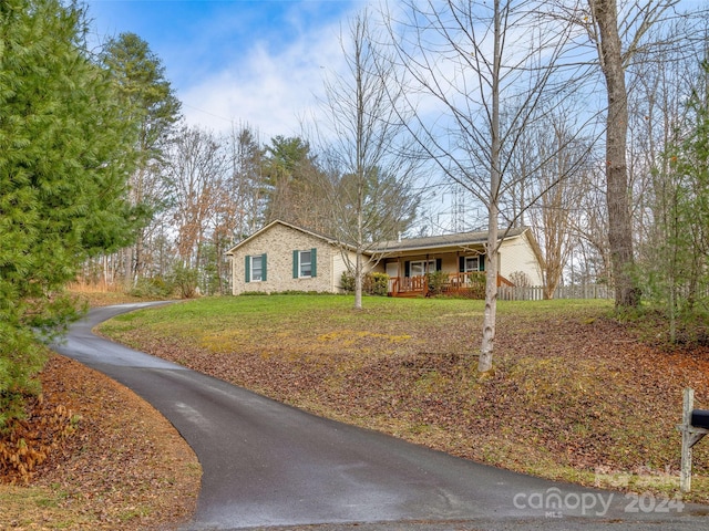 single story home featuring covered porch