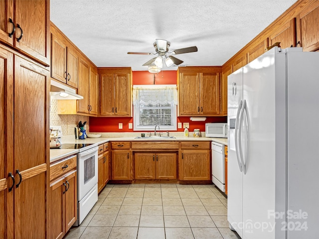 kitchen with ceiling fan, white appliances, sink, and light tile patterned floors