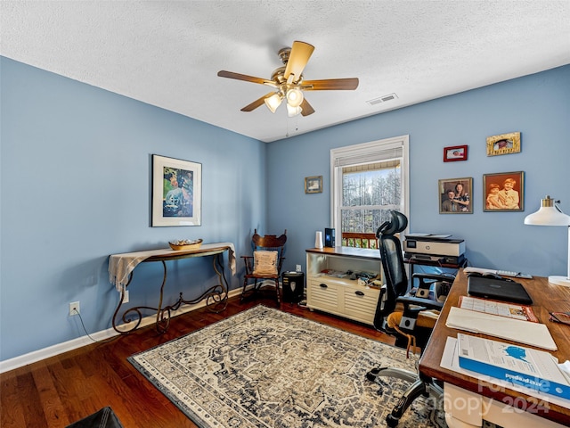 office space featuring a textured ceiling, dark hardwood / wood-style floors, and ceiling fan