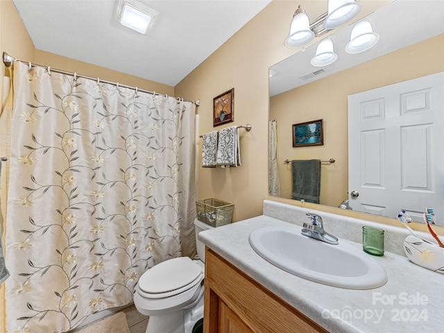 bathroom featuring tile patterned floors, vanity, toilet, and a shower with curtain