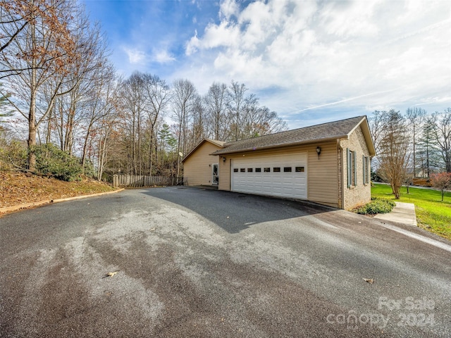 view of side of property featuring a garage