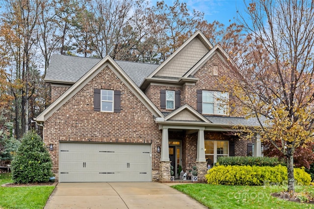 craftsman-style home featuring a porch and a garage