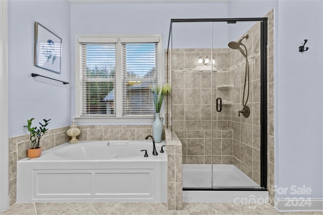 bathroom with separate shower and tub