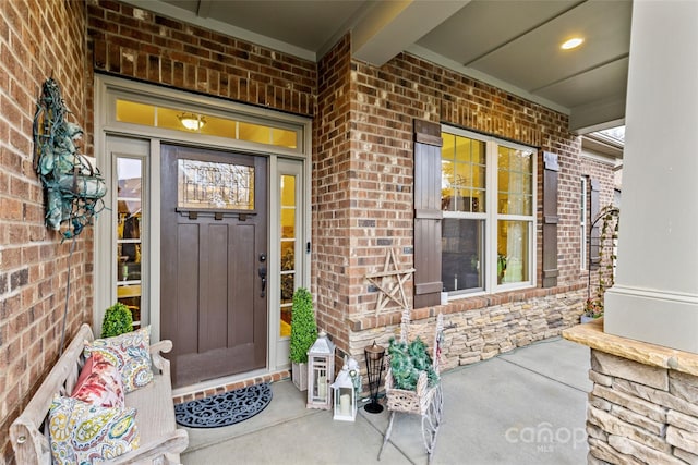 doorway to property featuring covered porch