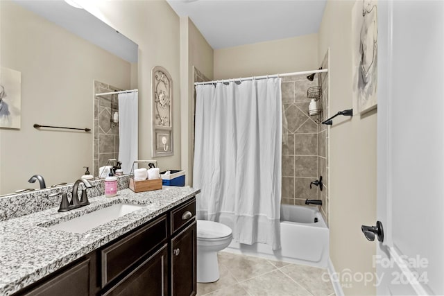 full bathroom featuring tile patterned floors, vanity, shower / bath combo, and toilet