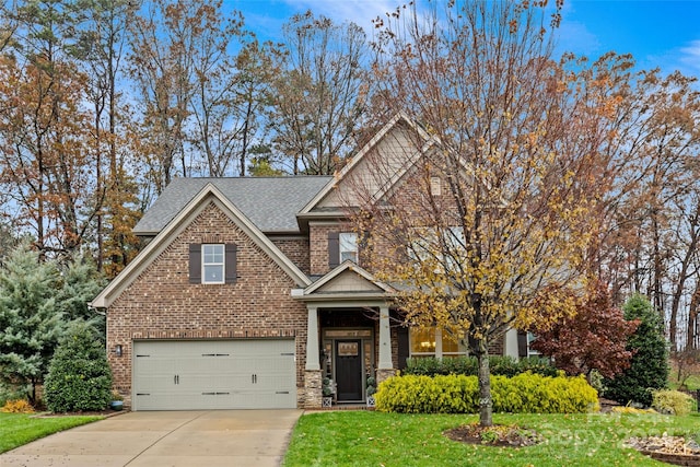 view of front of home featuring a garage and a front lawn