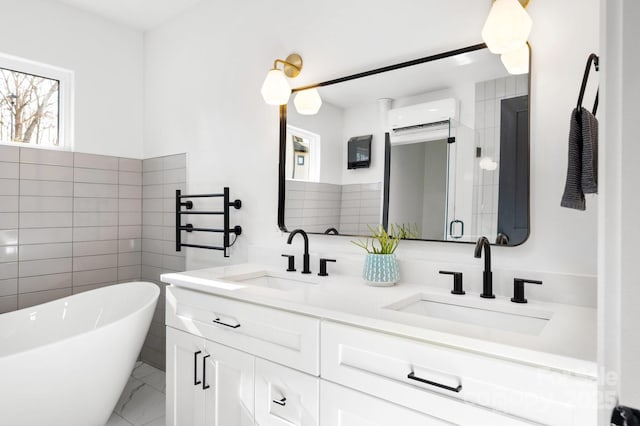 bathroom featuring a wall mounted AC, a bathtub, and vanity