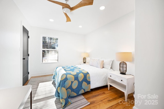 bedroom featuring hardwood / wood-style flooring and ceiling fan