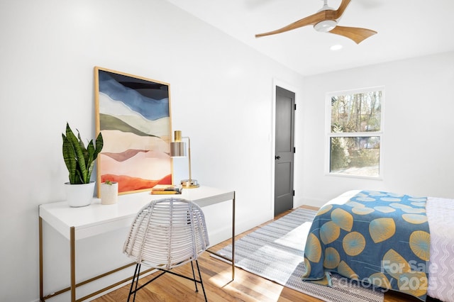 bedroom with ceiling fan and light wood-type flooring