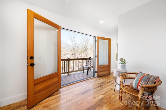 interior space with french doors and light hardwood / wood-style flooring