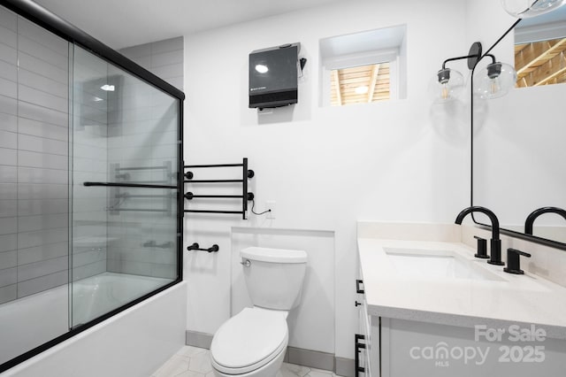 full bathroom featuring vanity, toilet, and combined bath / shower with glass door