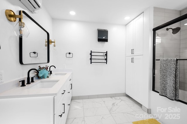 bathroom with vanity, a shower with door, and an AC wall unit