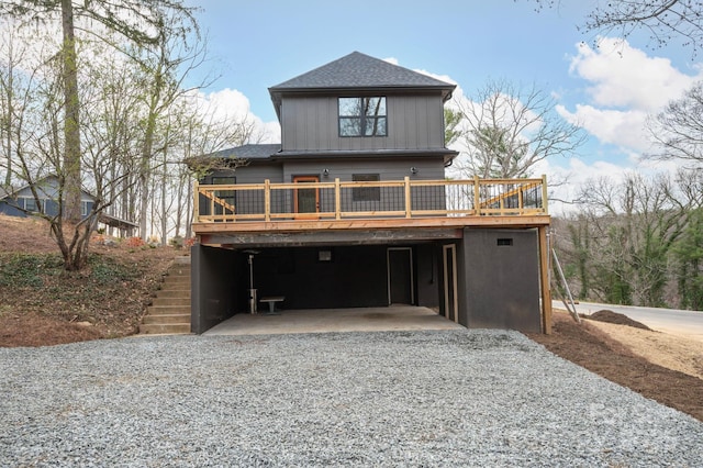 view of front facade with a wooden deck