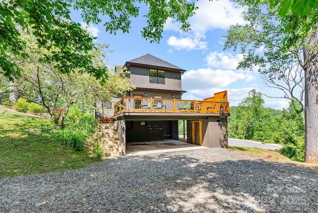 107 Beautyberry Dr, Asheville, NC 28801 - coastal inspired home featuring a carport, gravel driveway, and a deck