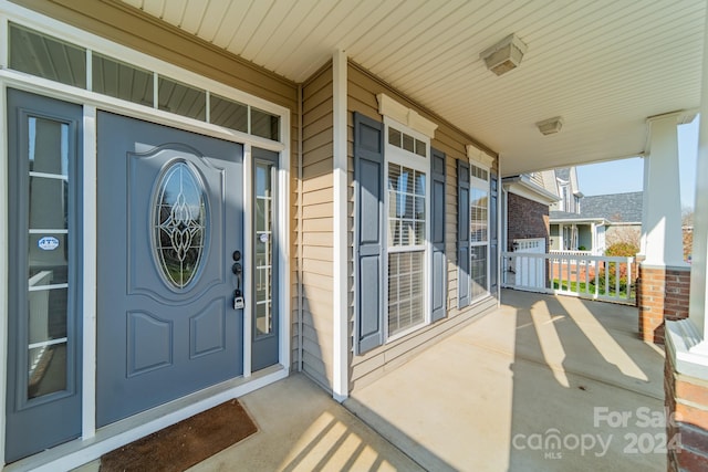 doorway to property with covered porch