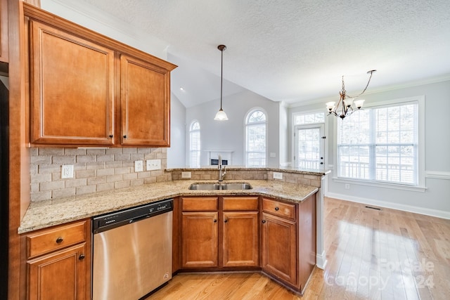 kitchen featuring dishwasher, a textured ceiling, and sink