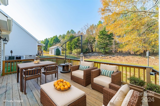 deck with a storage unit and an outdoor hangout area