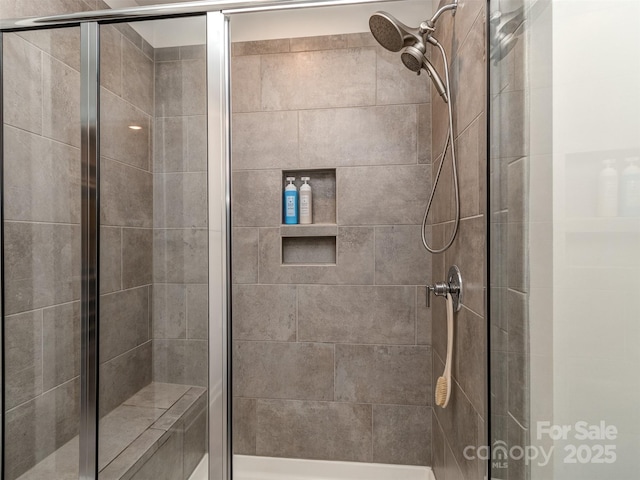 bathroom featuring an enclosed shower