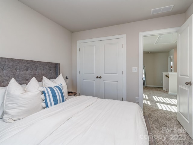 carpeted bedroom featuring a closet