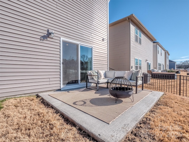 view of patio / terrace with an outdoor living space with a fire pit