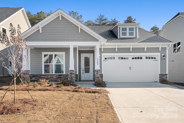 craftsman house with a garage