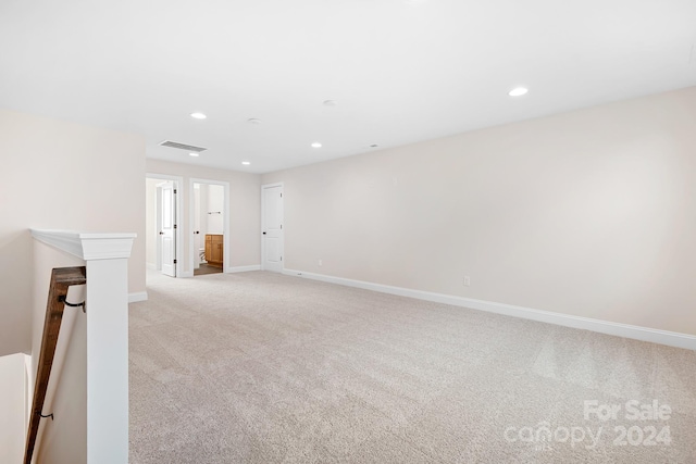 empty room featuring light colored carpet