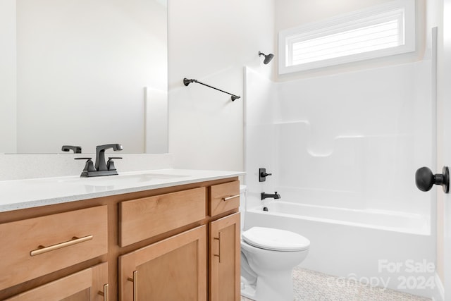 full bathroom featuring shower / bathing tub combination, vanity, and toilet