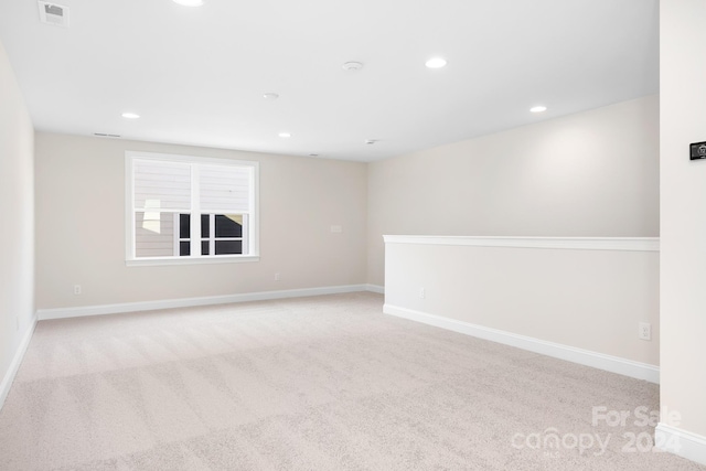 spare room with light colored carpet