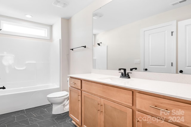 full bathroom featuring bathing tub / shower combination, vanity, and toilet