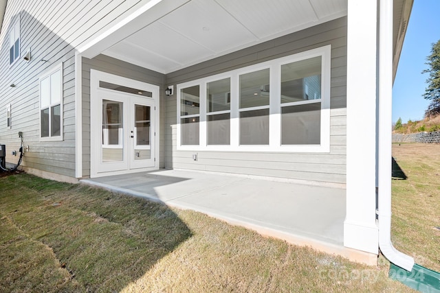 exterior space with a yard and french doors