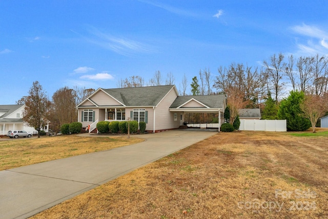 single story home featuring a front lawn and a carport