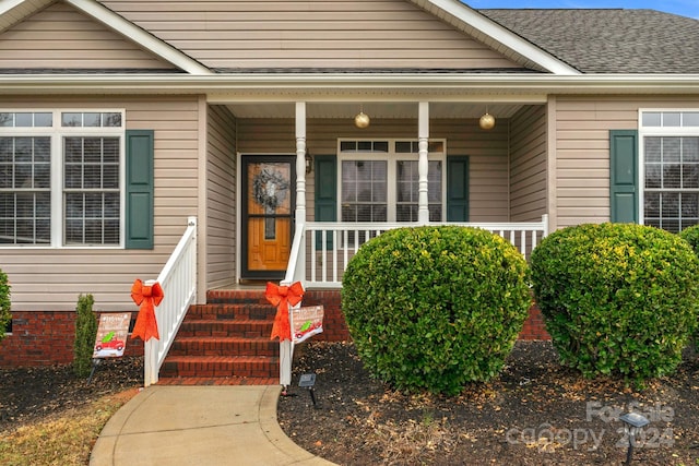 entrance to property featuring covered porch