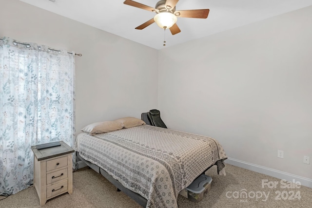 bedroom with ceiling fan and light carpet