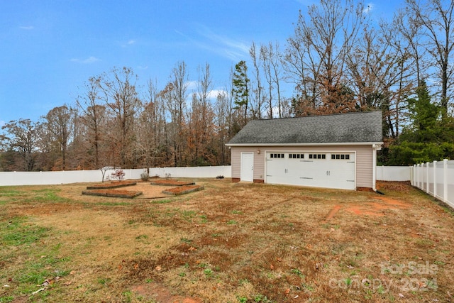 garage with a yard