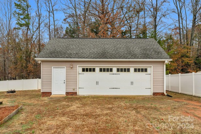 garage featuring a yard