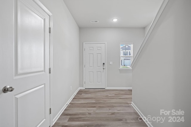 entryway with light hardwood / wood-style flooring