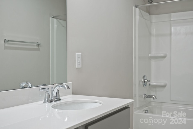 bathroom featuring vanity and shower / washtub combination