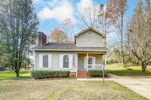 view of front of property with a front lawn and covered porch