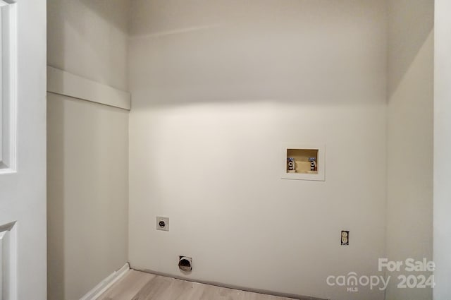 laundry area with hookup for a washing machine, light hardwood / wood-style floors, and electric dryer hookup