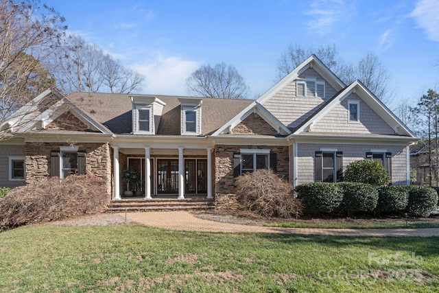 craftsman-style house featuring a front lawn