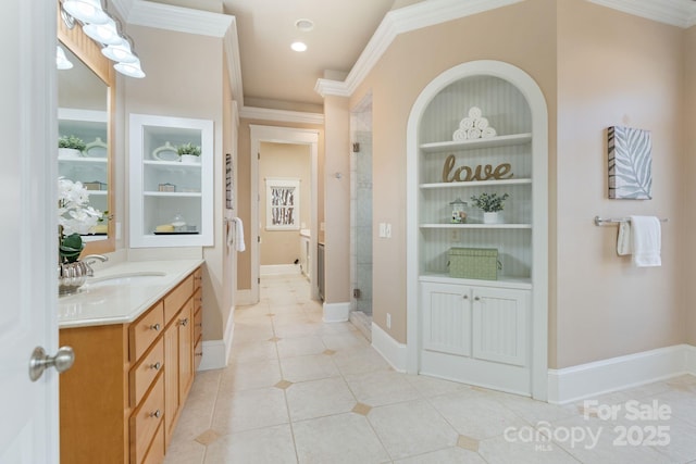 bathroom with ornamental molding, vanity, an enclosed shower, tile patterned floors, and built in shelves