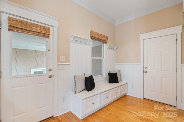 mudroom featuring crown molding and light hardwood / wood-style floors