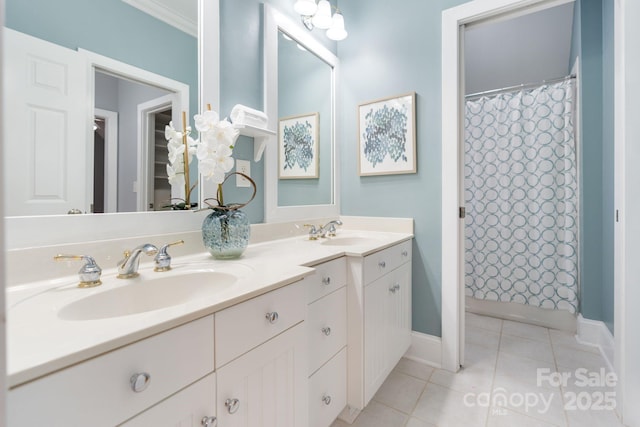 bathroom with tile patterned floors, curtained shower, and vanity